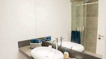 Shower, hair dryer, towels, soap