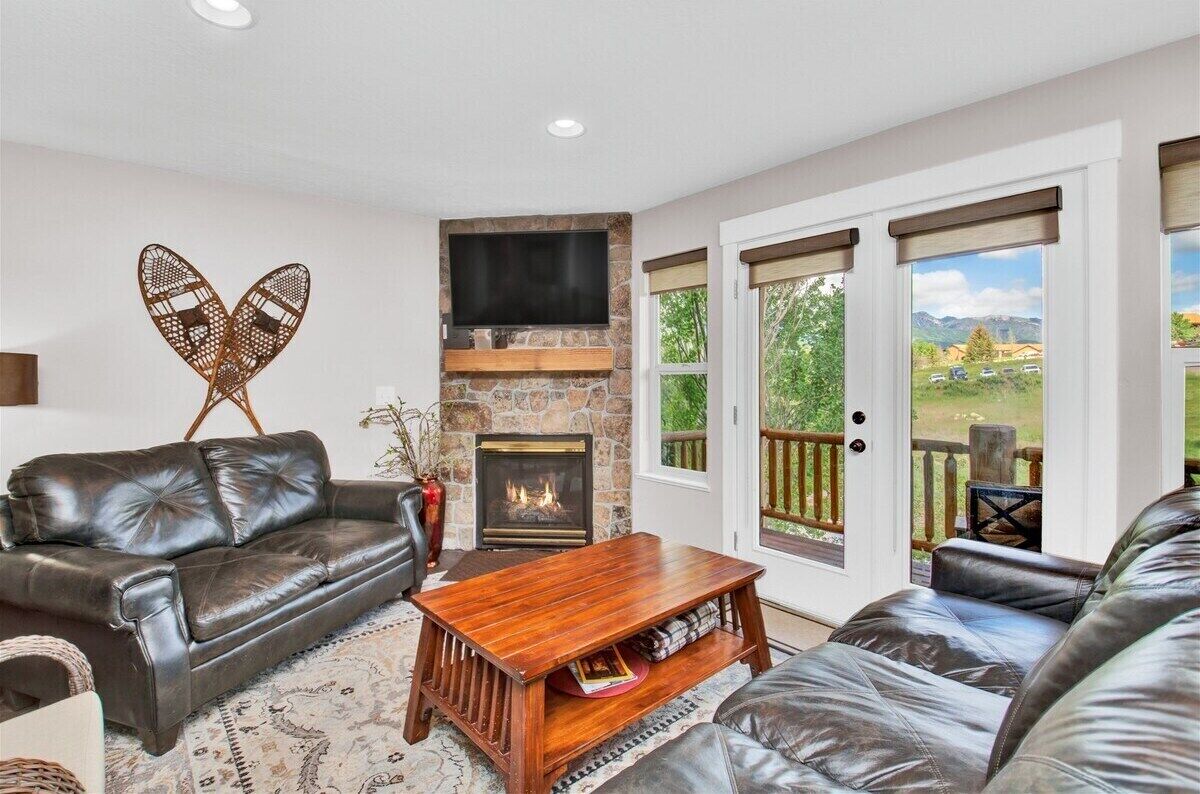 TV, fireplace, books, printers