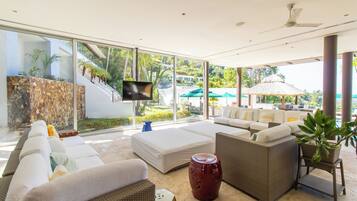 Villa | Living area | 55-inch flat-screen TV with cable channels
