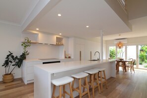 Enjoy a functional workspace and cozy dining area in this well-equipped kitchen.