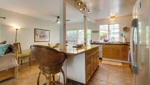 A spacious kitchen with a central island, wooden cabinets, and a refrigerator. - 50 ft from the SAND 30 seconds (Del Mar)