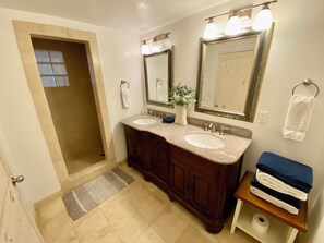 Shower, hair dryer, towels, soap