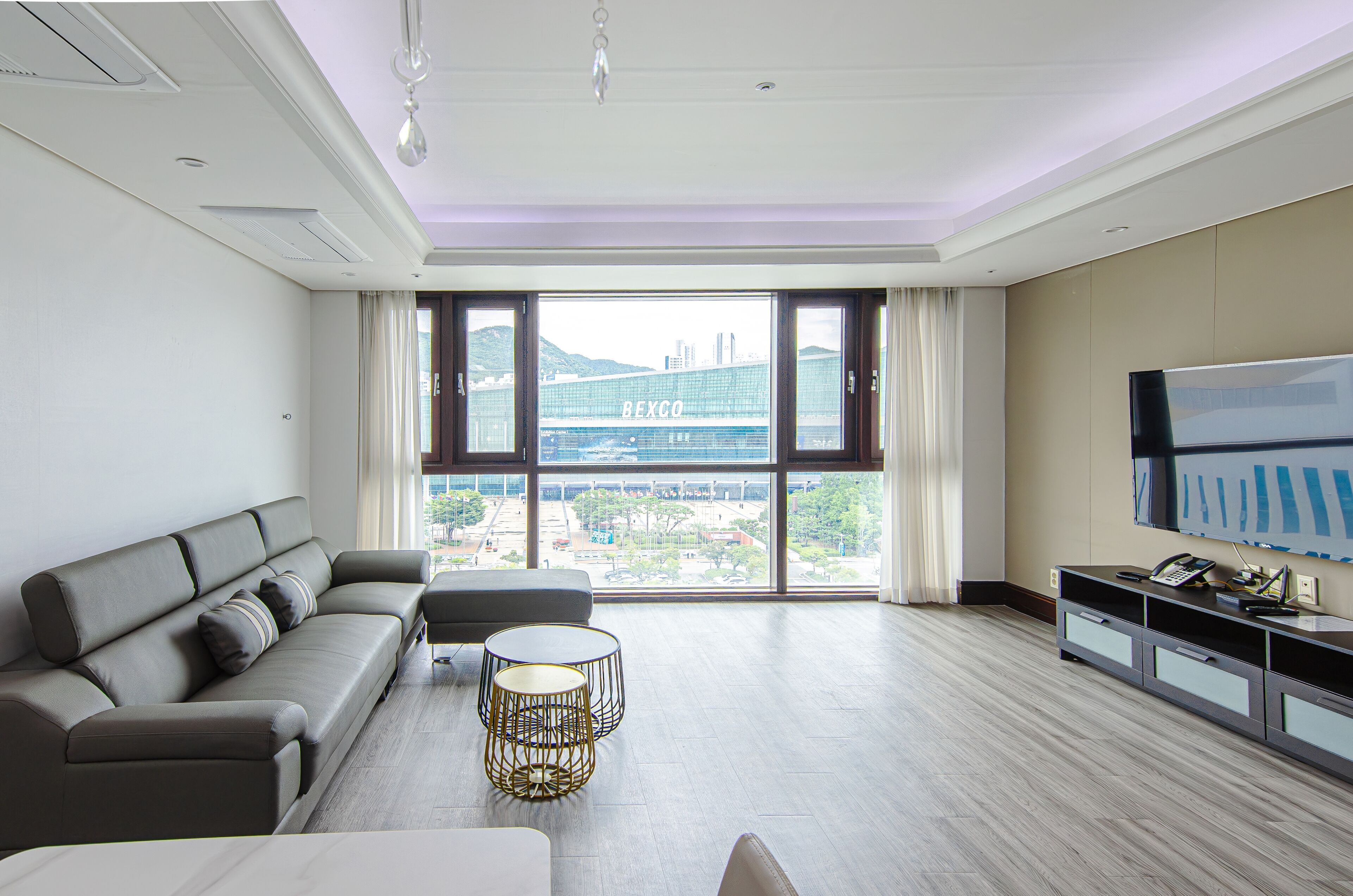 Family Suite, Multiple Beds | Living area | 43-inch flat-screen TV with cable channels