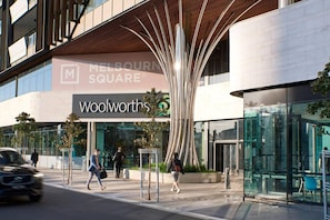 Experience the sleek, curved design of this Melbourne store, featuring a striking entrance and expansive glass windows.