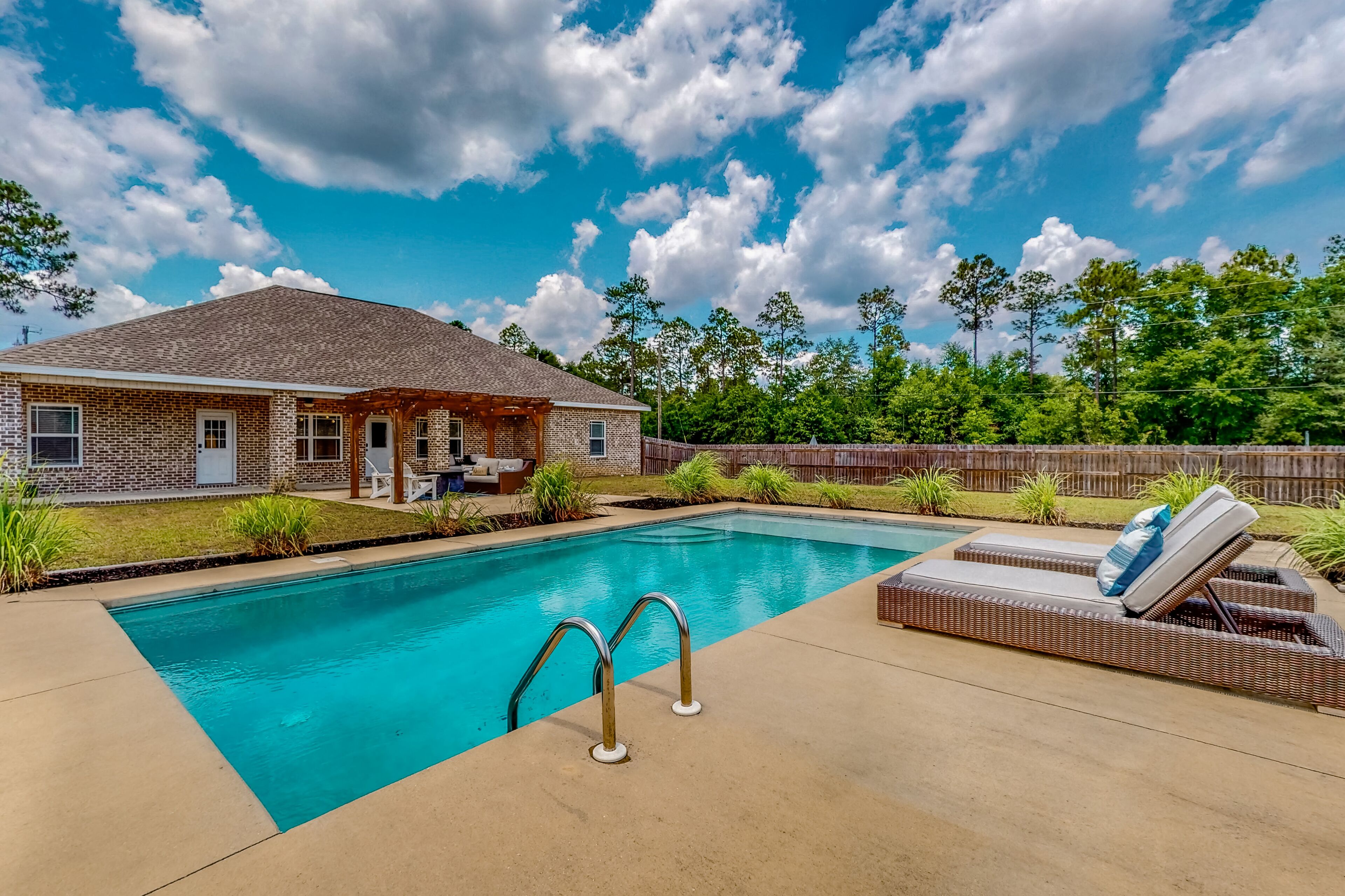 Nautical-themed retreat with a saltwater pool, fire table, full kitchen, and AC