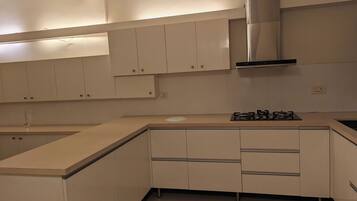 Microwave, stovetop, cookware/dishes/utensils, dining tables