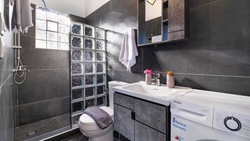 Bathtub, hair dryer, towels