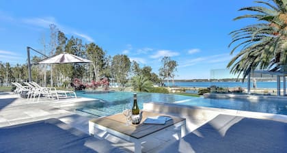 Lake Palm Resort Luxury Retreat absolute Waterfront on 3 acres at Lake Macquarie.