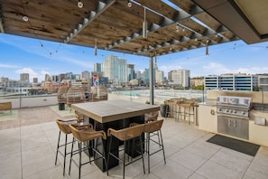 Outdoor dining - Modern Downtown Retreat | Balcony + Rooftop Views (San Diego)