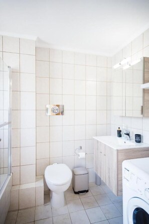 Hair dryer, slippers, towels, soap