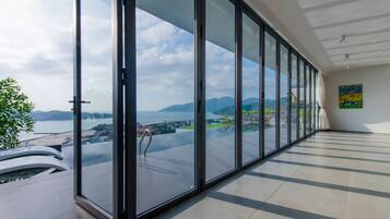 Premium Villa, 4 Bedrooms, Beach View | Living area | Flat-screen TV, fireplace, heated floors