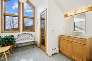 Natural Light Before You Unwind - This sunlit area connects the bathroom and private sauna, adding an open, airy feel to your spa experience.