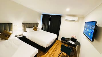 Executive Triple Room | Living area | Flat-screen TV