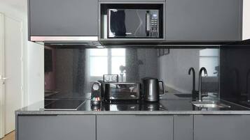Fridge, microwave, stovetop, coffee/tea maker