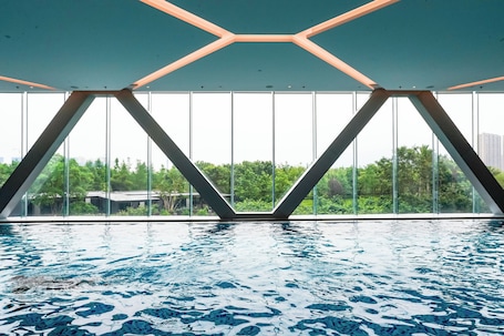 Indoor pool, open 7:00 AM to 10:00 PM, sun loungers, lifeguards on site