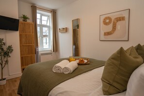 1 bedroom, desk, iron/ironing board, travel crib