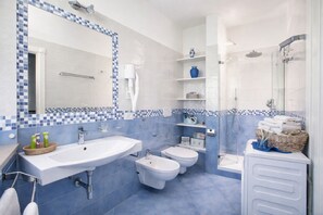 Shower, hair dryer, bidet, towels