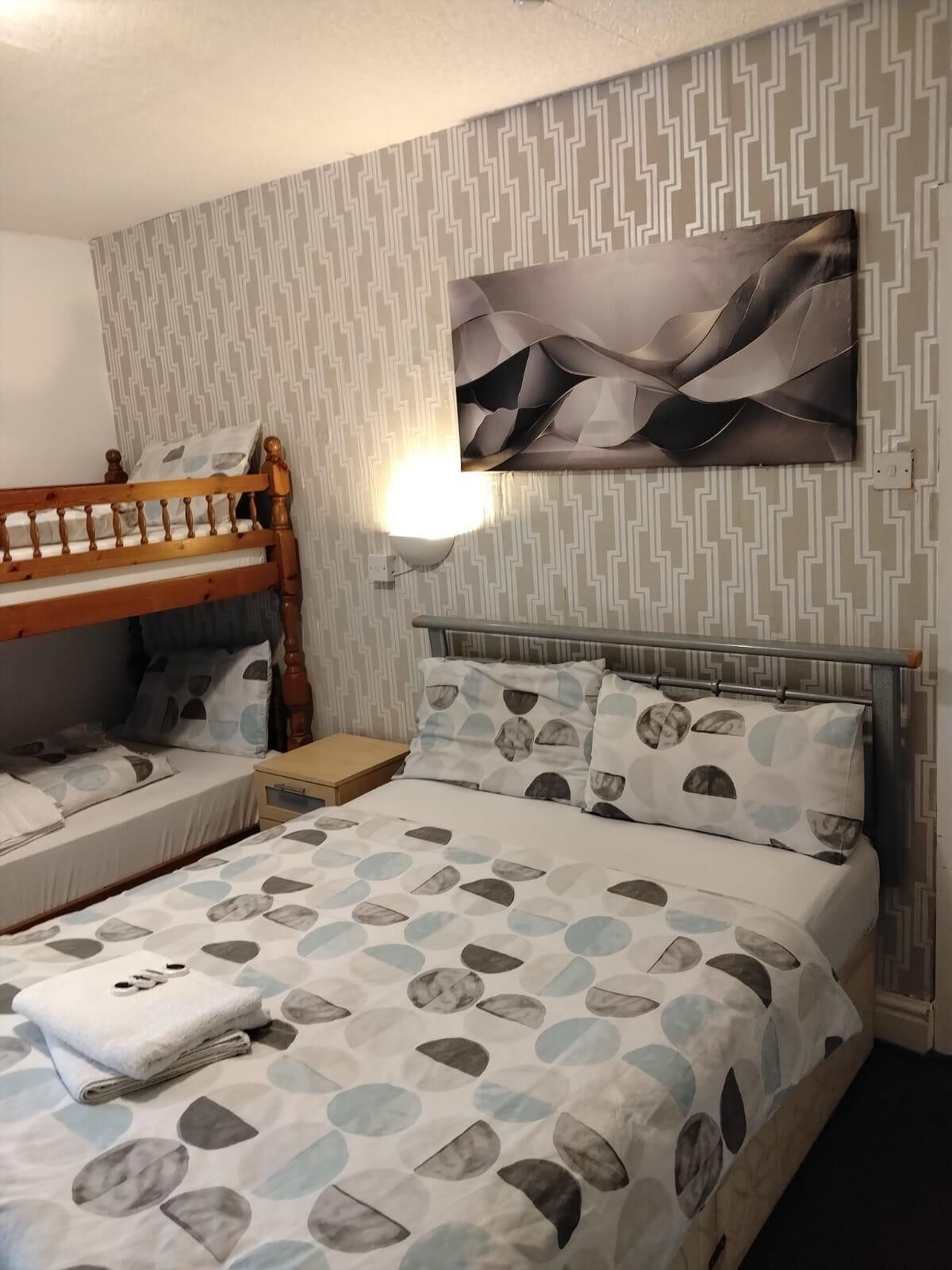 Deluxe Quadruple Room, Non Smoking | Egyptian cotton sheets, premium bedding, pillow-top beds, free WiFi