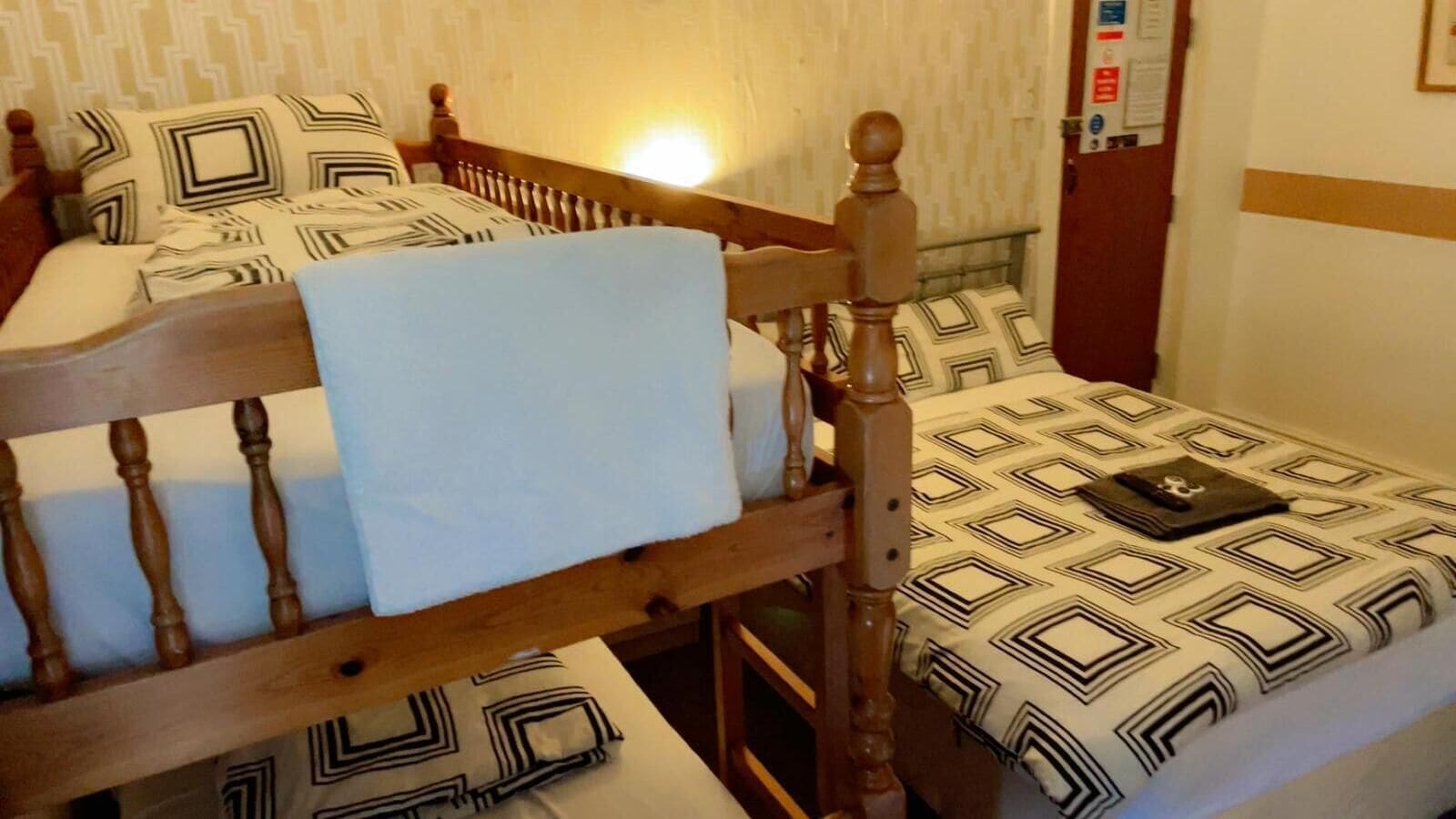 Deluxe Quadruple Room, Non Smoking | Egyptian cotton sheets, premium bedding, pillow-top beds, free WiFi