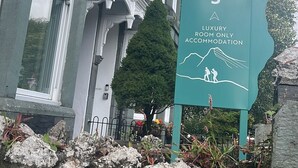 A tall sign for 'Ambleside Fell Rooms' indicating a luxury room-only accommodation. - Ambleside Fell Rooms (Ambleside)