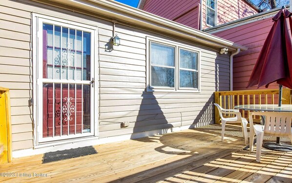Enjoy meals and relaxation on the deck with a round table and four chairs.