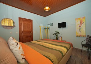 Economy Apartment | Minibar, in-room safe, individually decorated, individually furnished