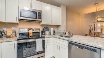 Coffee/tea maker, fridge, microwave, oven