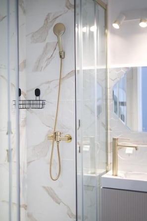 Shower, eco-friendly toiletries, hair dryer, towels