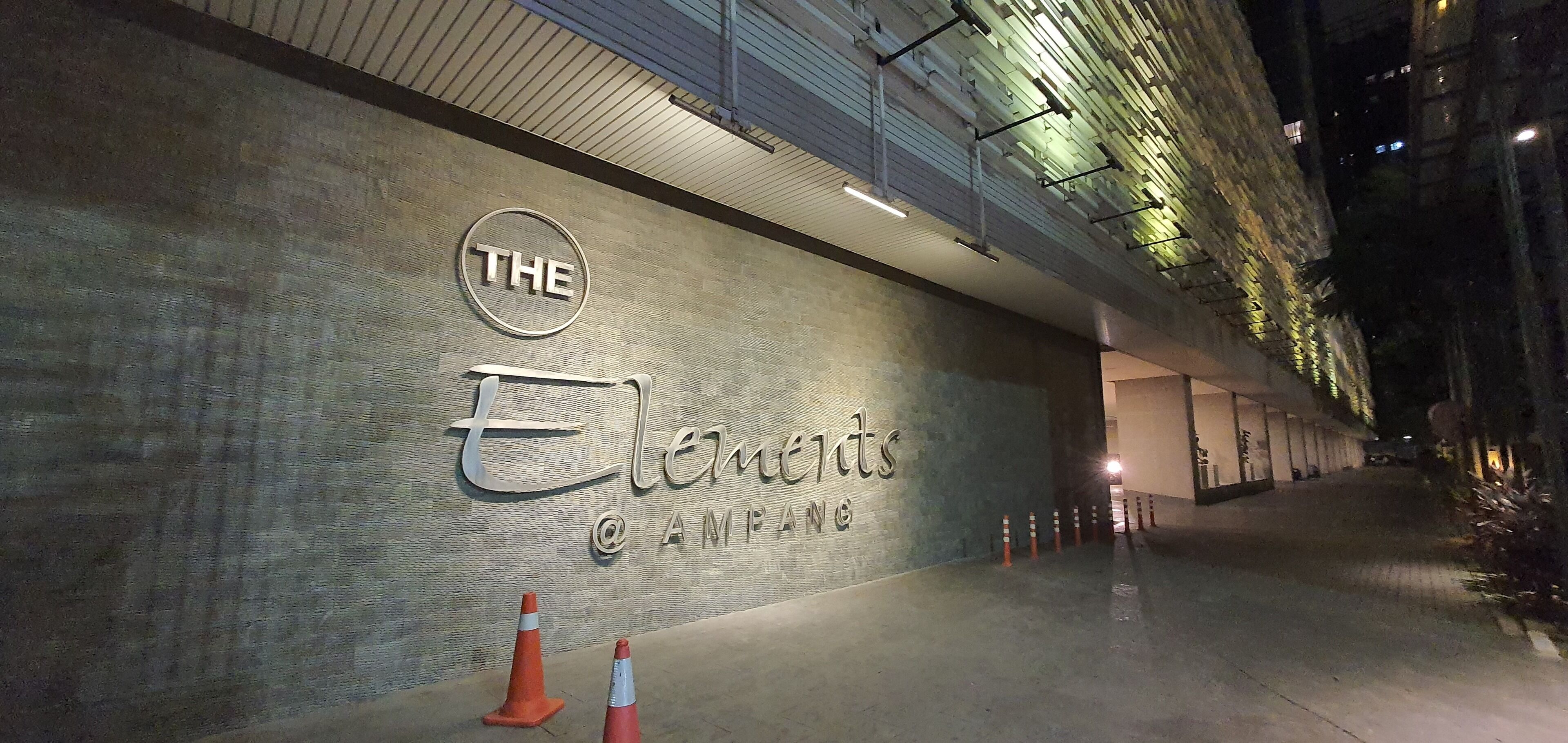 A building exterior with a sign that reads "THE Elements @ AMPANG."