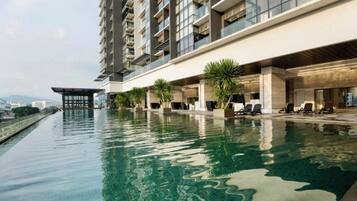 2 outdoor pools, open 7:00 AM to 10:00 PM, pool umbrellas, sun loungers