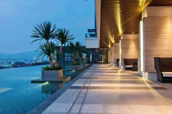 2 outdoor pools, open 7:00 AM to 10:00 PM, pool umbrellas, pool loungers