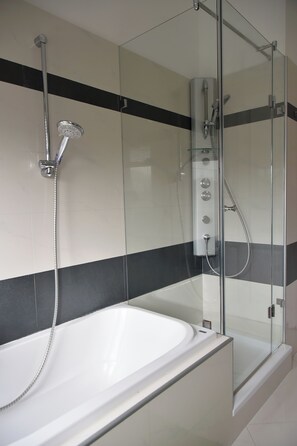 Shower, eco-friendly toiletries, hair dryer, towels