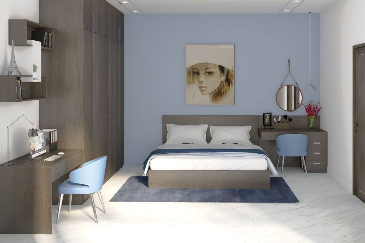 A modern bedroom with a bed, a desk, and a chair.