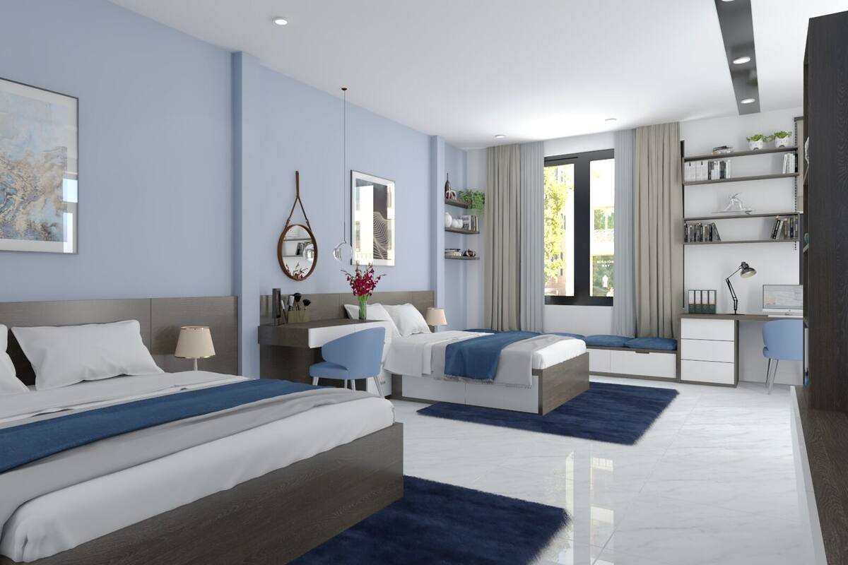 A modern hotel room with two beds, a desk, a chair, a bookshelf, and a large window with curtains.