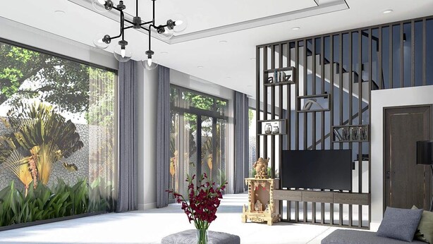 A modern living room with a large TV, a decorative statue, and a view of greenery through a glass wall. - Oscar Villa (Da Nang)