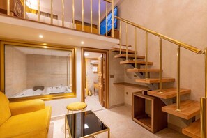 A modern interior with a staircase, a sofa, and a glass partition. - Wyndham Istanbul Old City (Istanbul)