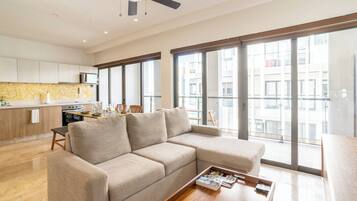 Deluxe Penthouse, 1 Bedroom | Living room | 55-inch Smart TV with cable channels