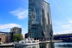 Situated beside a serene body of water, this building offers stunning views and a sleek, contemporary design.