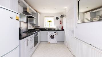 Microwave, oven, dishwasher, dining tables