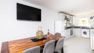 Microwave, oven, dishwasher, dining tables
