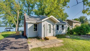 A small, single-story house with a front porch, a garage, and a backyard. - Waterfront Lodi Vacation Rental on Lake Wisconsin! (Lodi)