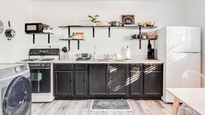 Fridge, coffee/tea maker, cookware/dishes/utensils