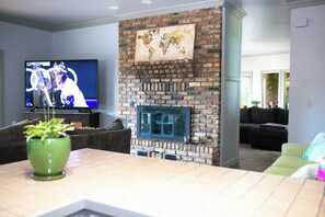 Smart TV, fireplace, books, music library