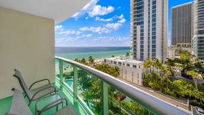 A balcony with a view of the ocean and tall buildings. - Luxe Oceanfront Condo in Hollywood Beach (Hollywood)