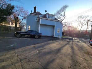 Two-story house with a garage and a driveway.
