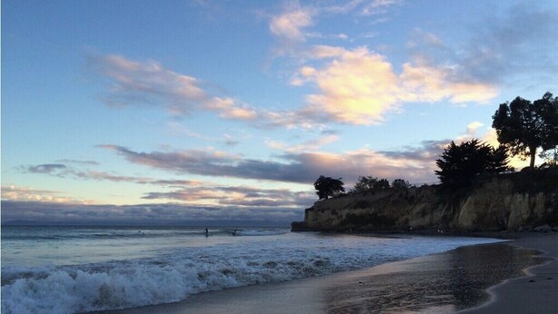 A beach with waves, a cliff, and trees. - FUN at the beach and park with Family & Friends! (Santa Barbara)