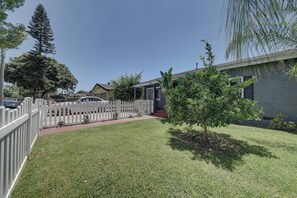 Stroll through the beautifully manicured lawn and enjoy the serene atmosphere of this charming home.