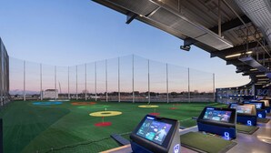 A sports stadium with multiple viewing screens, a green field, and a large seating area. - Sleeps 9, Pet Friendly, Workspace, Easy Access to Dining and Shops (Meridian)