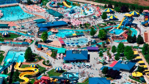 A large outdoor amusement park with multiple water slides, pools, and shaded areas. - Sleeps 9, Pet Friendly, Workspace, Easy Access to Dining and Shops (Meridian)