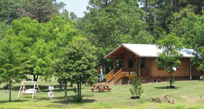 Log cabin overlooking a private lake on a working farm